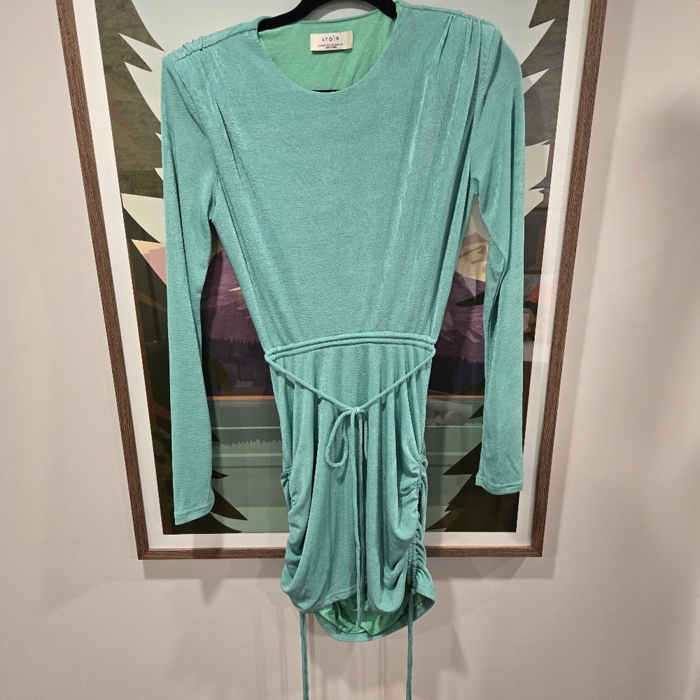 Beautiful Mint Dress with back cut out with adjustable sides on skirt